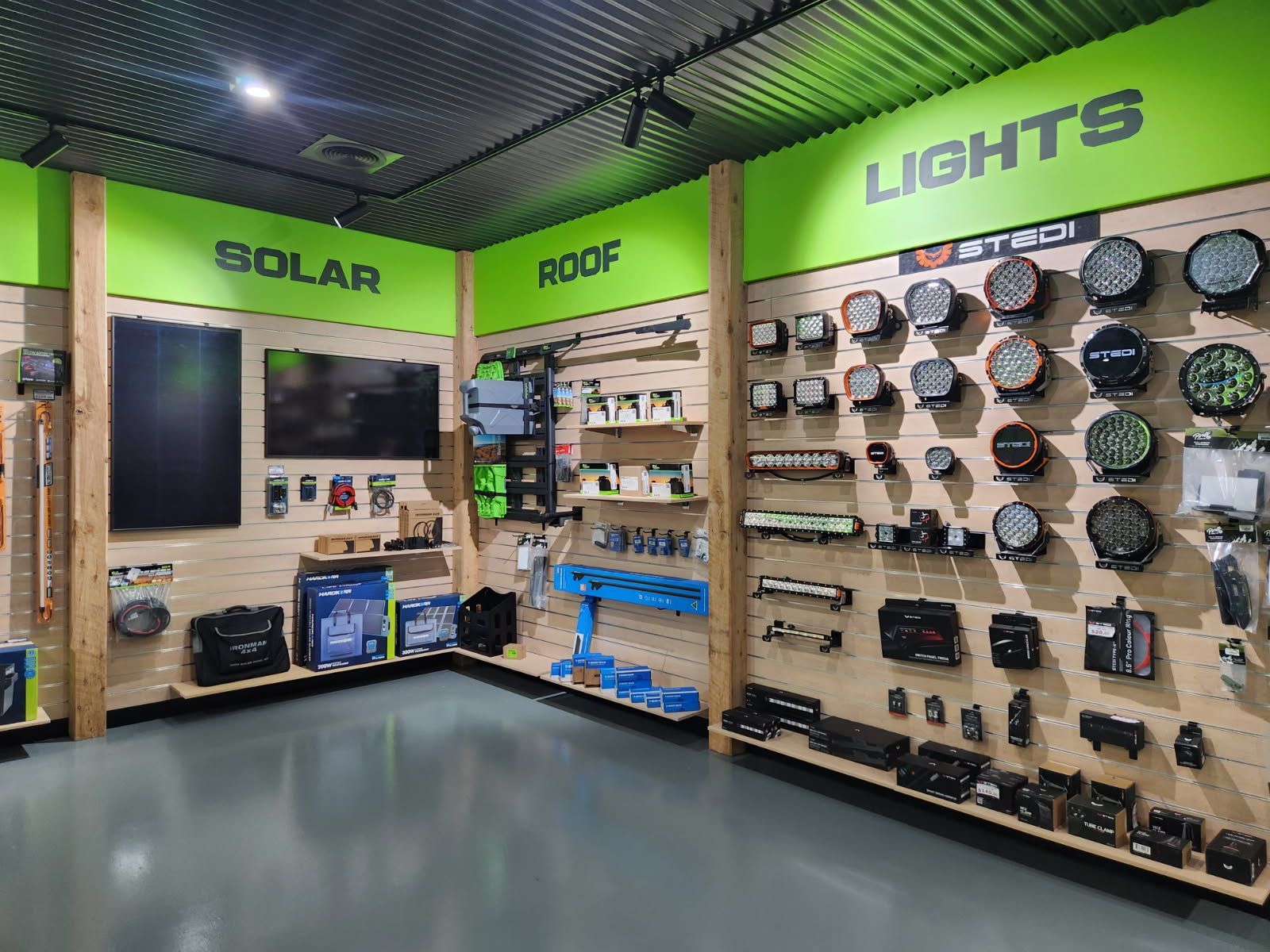A well-lit store displays vehicle accessories on wooden panel walls — Off Road Accessories in Wangaratta, VIC