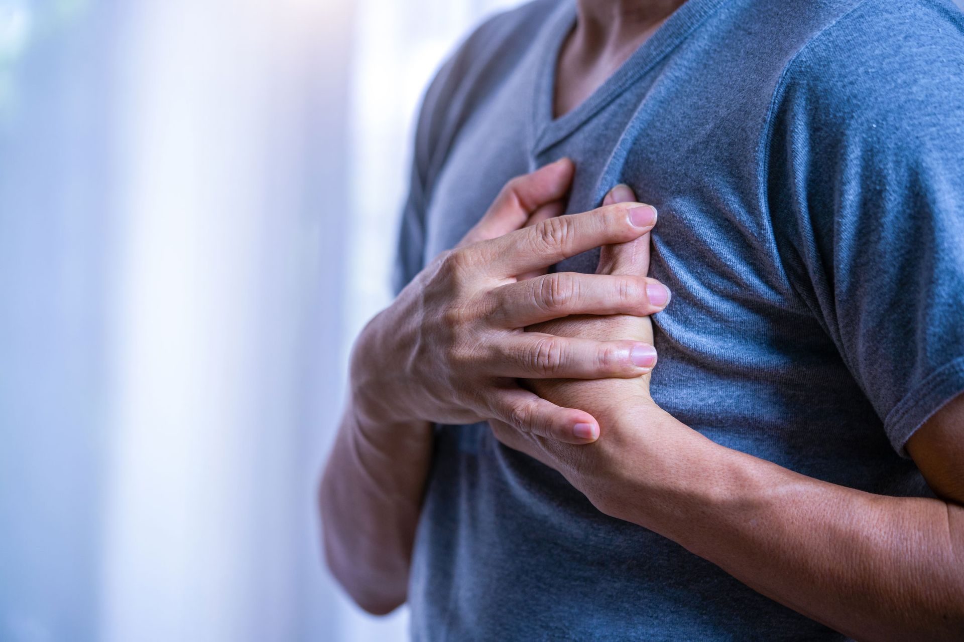 Men Holding Breast — Baltimore & Washington DC — The Law Offices Of Cardaro & Peek, LLC