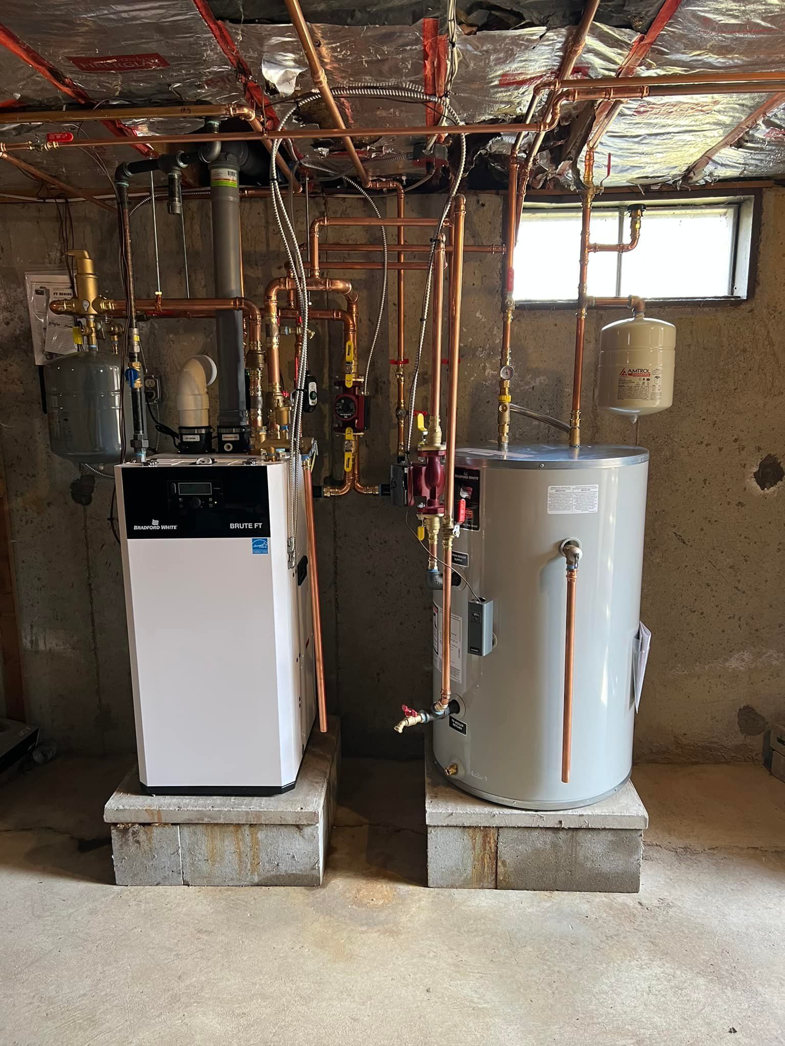A basement with a water heater , sink , and shelves.