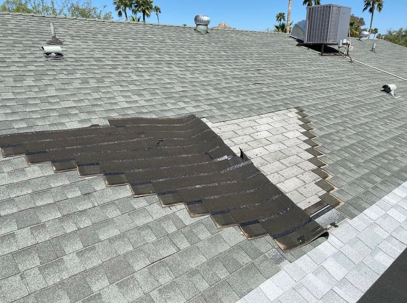 local roofing company to repair shingle damage on my roof from a wind storm