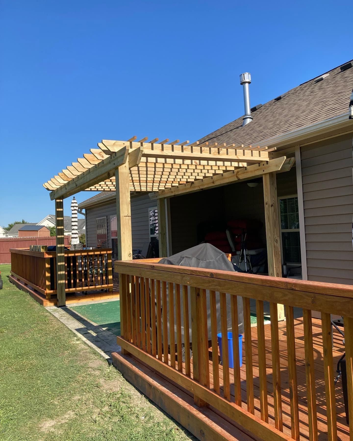 Close-up of a wooden fence with vertical slats and a diagonal top rail