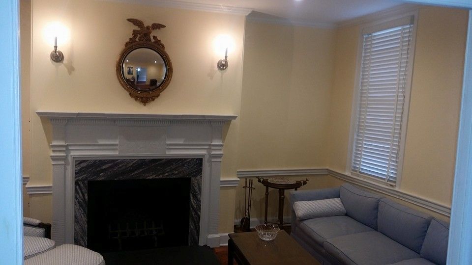 A living room with a fireplace and a couch