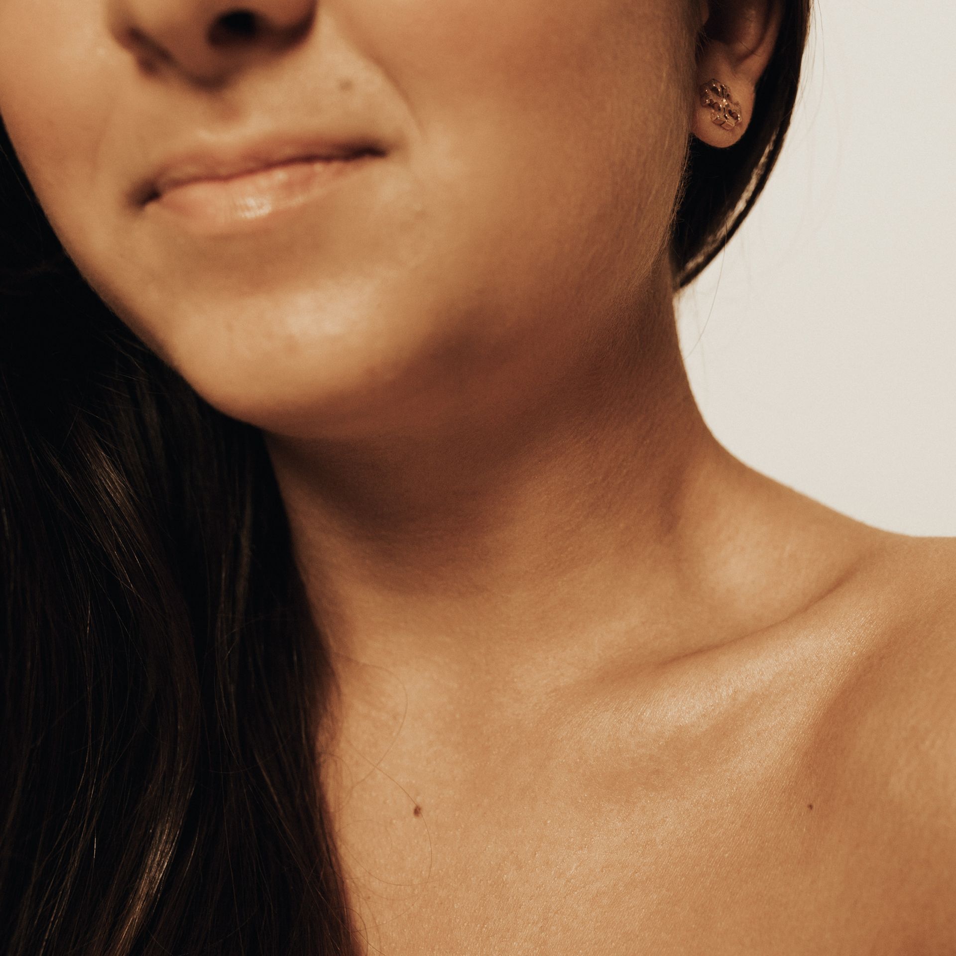 a close up of a woman 's neck and shoulder