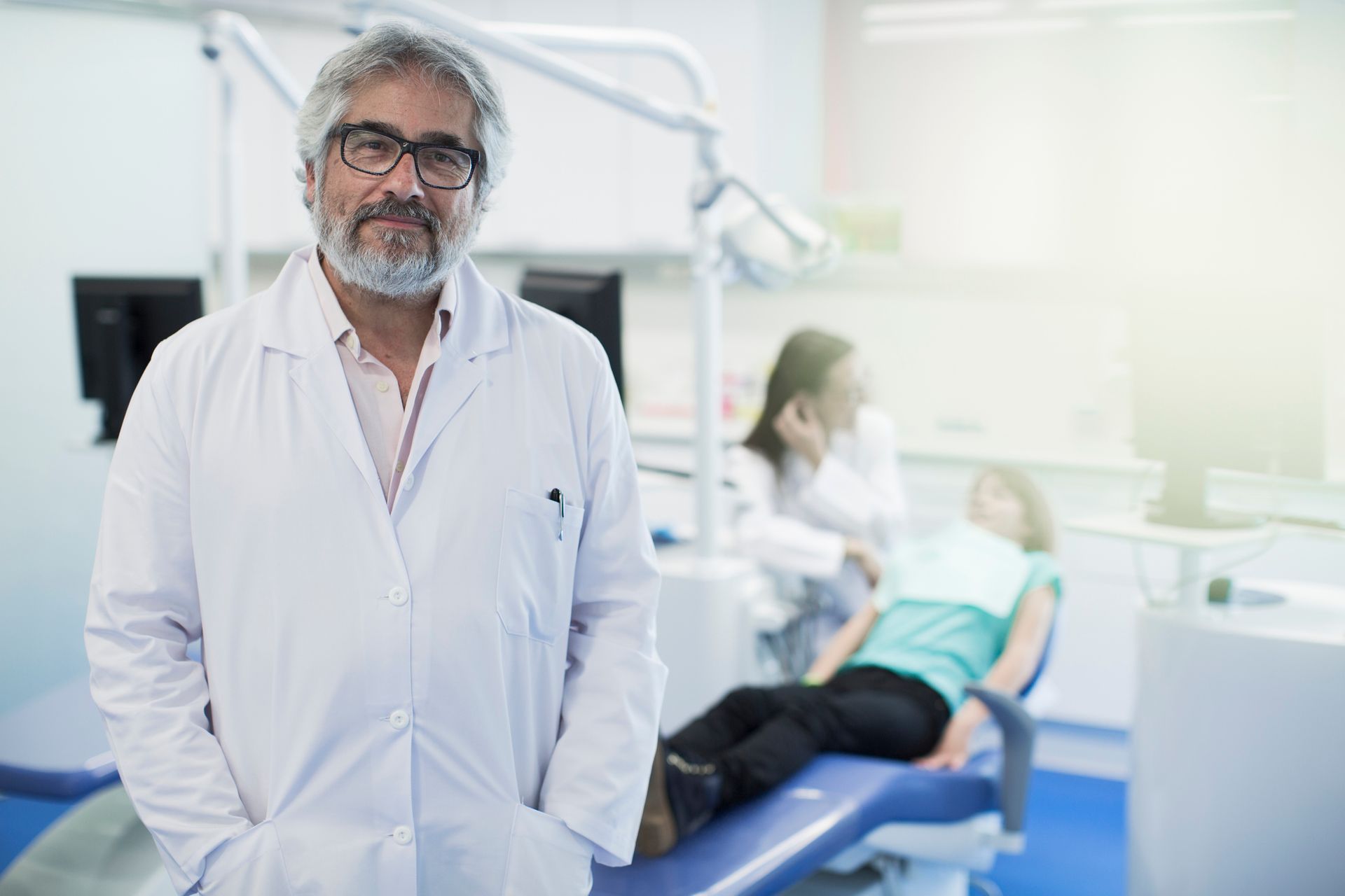 Confident emergency dentist ready to help, smiling at the camera 