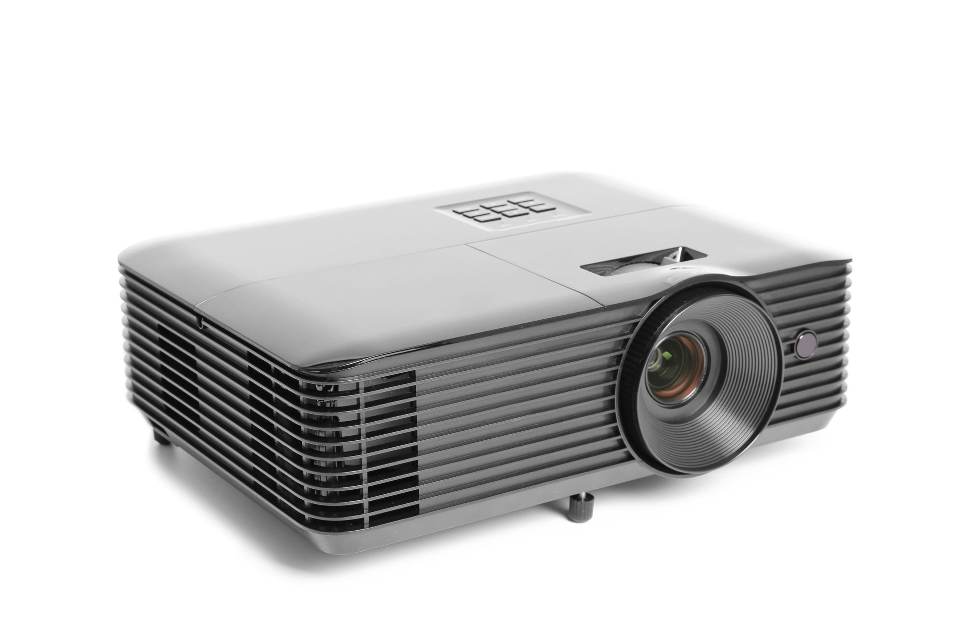 A white projector is sitting on a white surface.