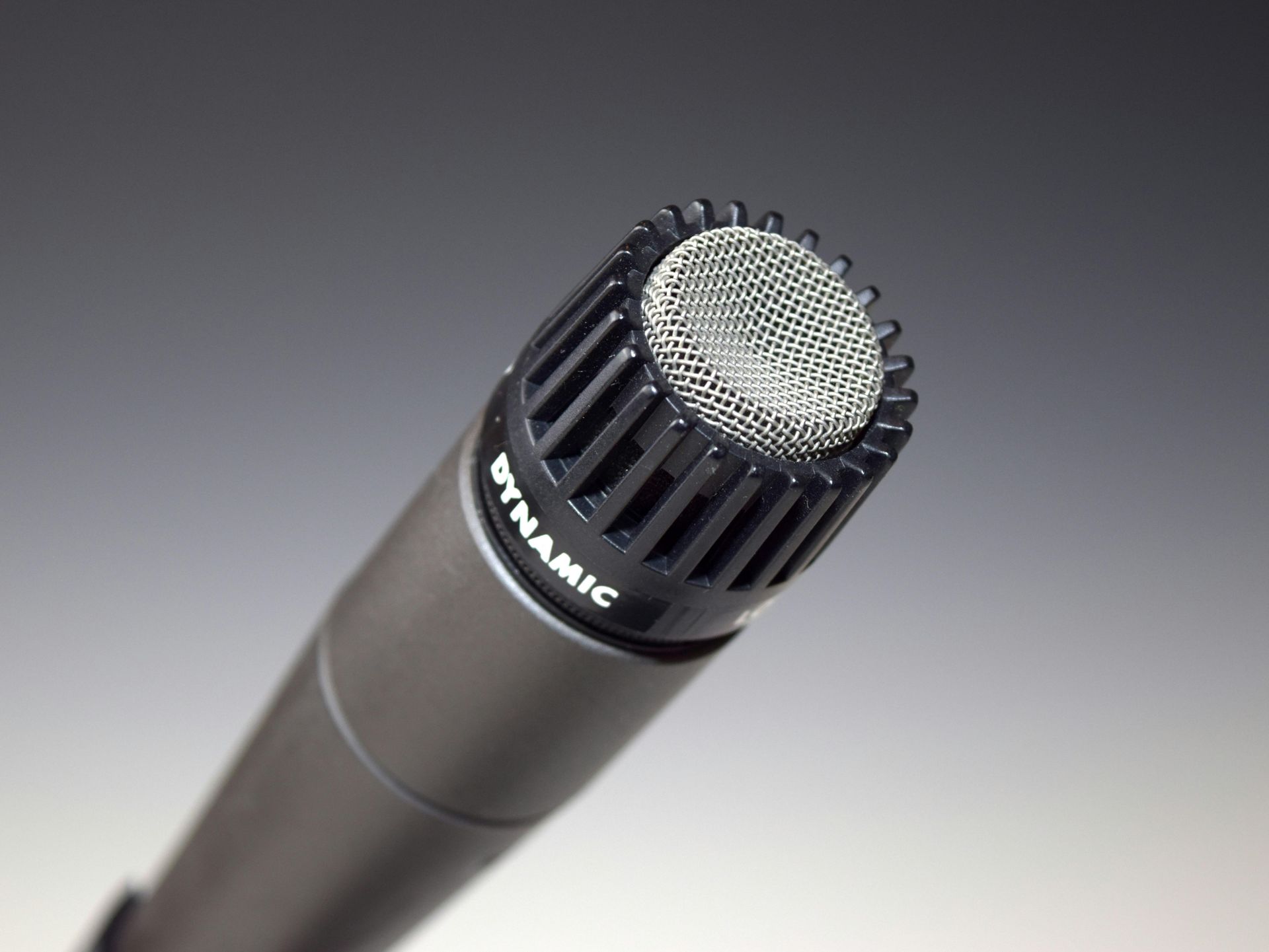 A dynamic microphone is sitting on a table
