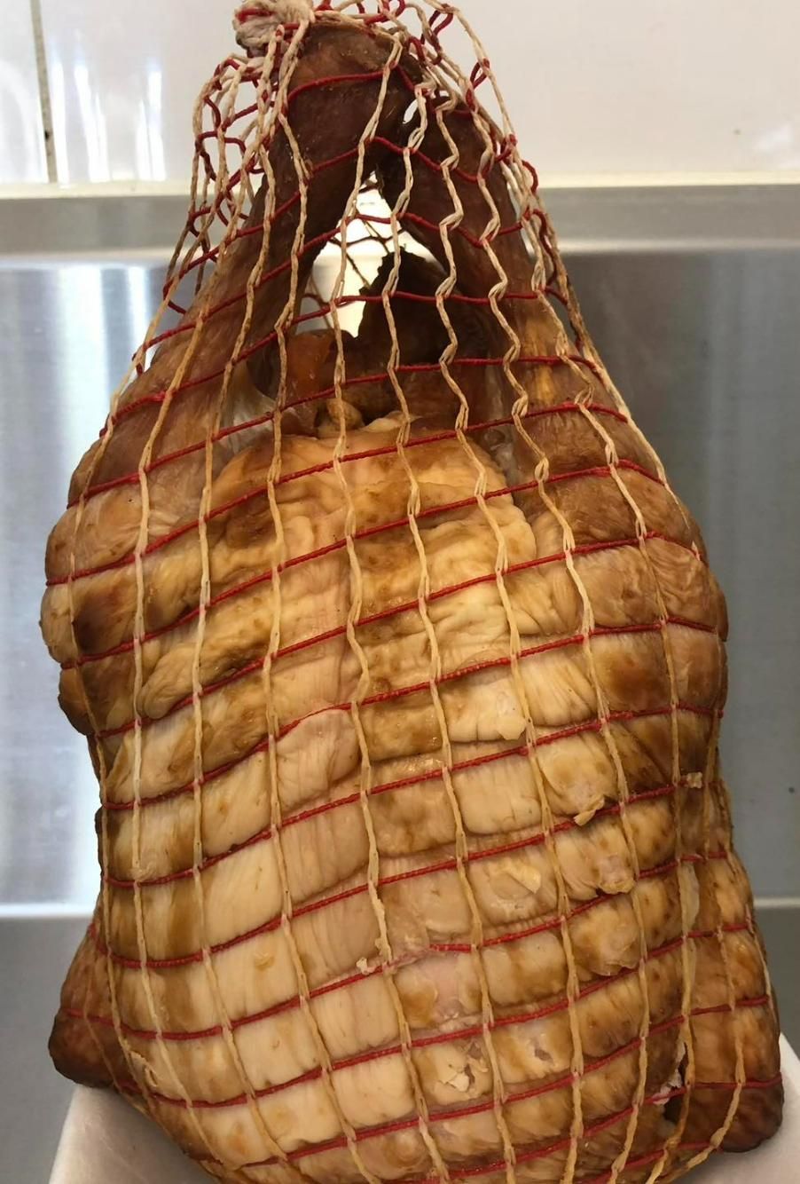 A Large Piece of Chicken Is Wrapped in A Net — Holiday Coast Meat & Smallgoods in South Grafton, NSW