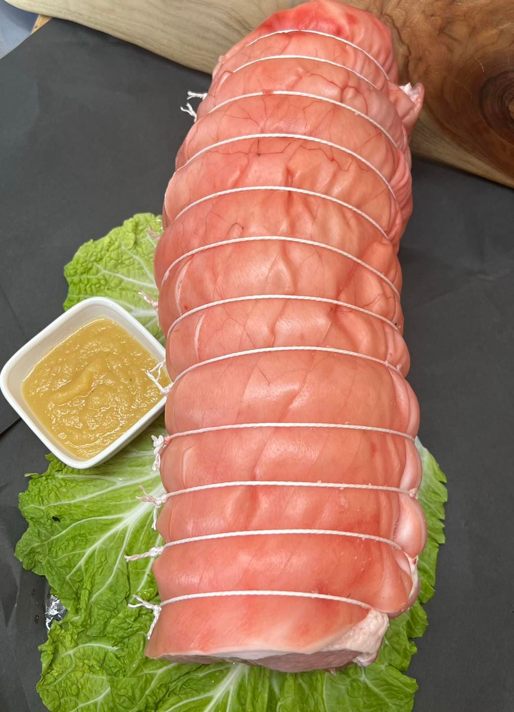 A Cutting Board Topped with Sliced Meat and Tomatoes — Holiday Coast Meat & Smallgoods in South Grafton, NSW