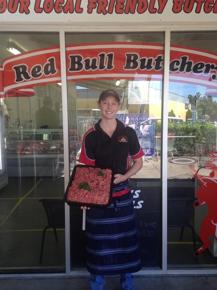 A Person Is Weighing Meat on A Scale in A Butcher Shop — Holiday Coast Meat & Smallgoods in South Grafton, NSW