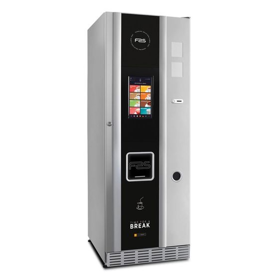 un distributore automatico di caffè con sopra una tazza di caffè