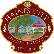 Haines City, Florida seal: gazebo, lake, tree; orange fruit at top; 