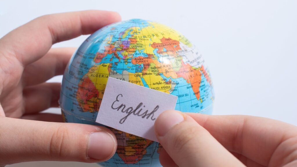 Hands holding a small globe with an 