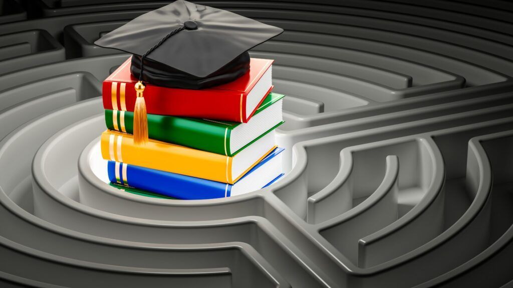 Graduation cap on stacked colorful books with maze background