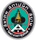 Emblem with Thai text and a golden tiered structure, green circle, white A shape, black border.