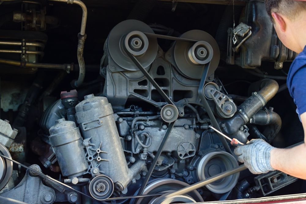 A Man Is Working On The Engine Of A Car — Passfield Automotive and Electrical In Cessnock, NSW