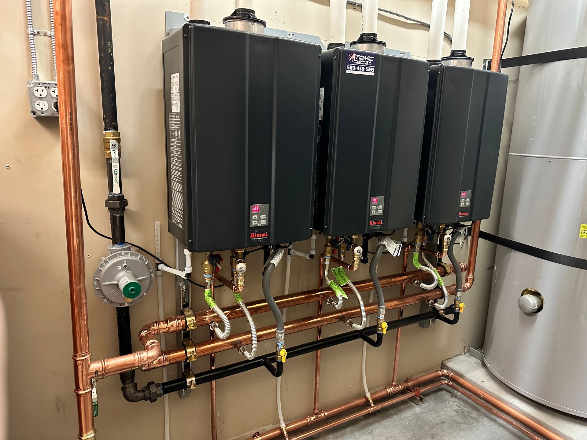 A water heater is mounted to a wall in a room