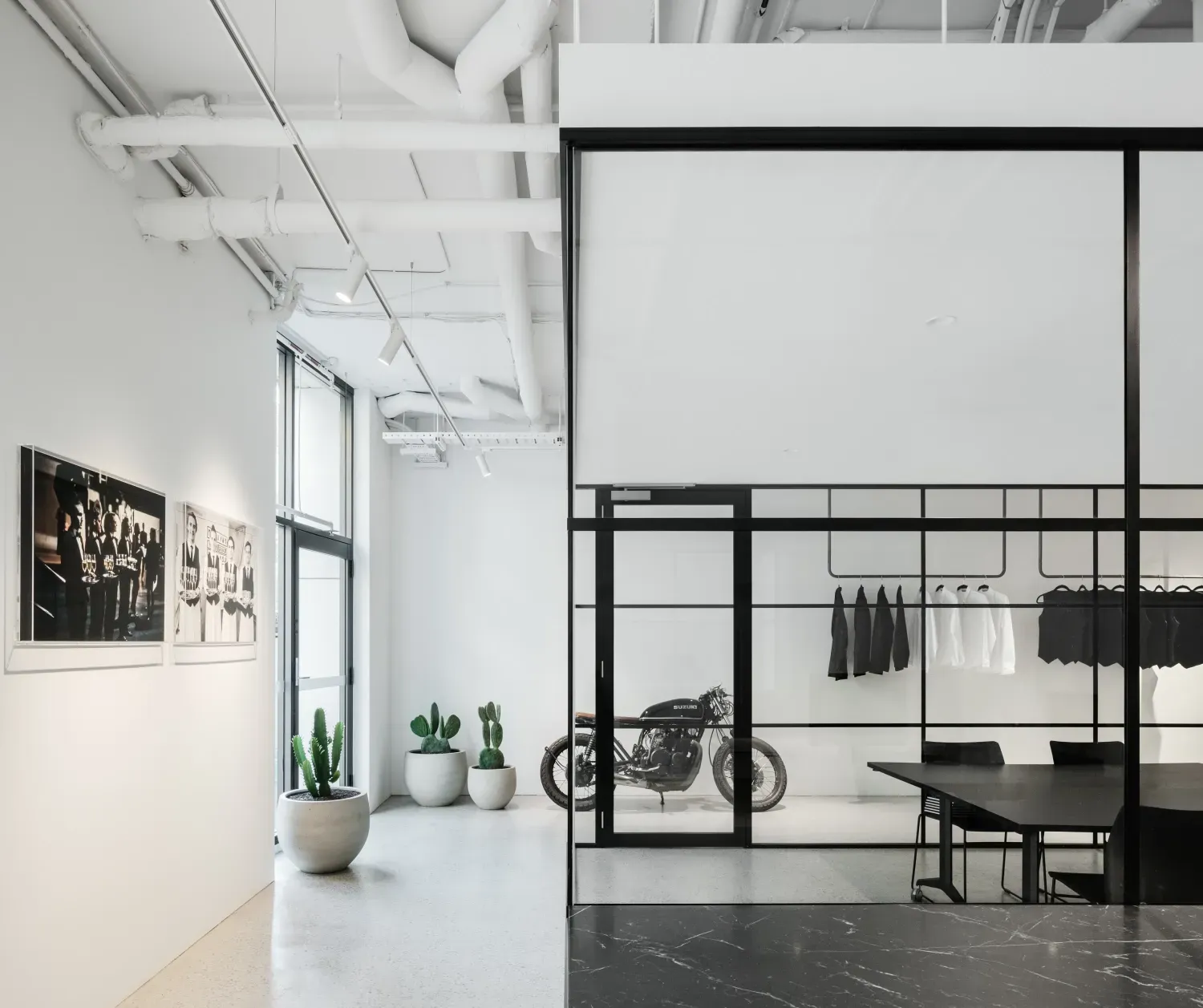 A motorcycle is parked in a room with a sliding glass door