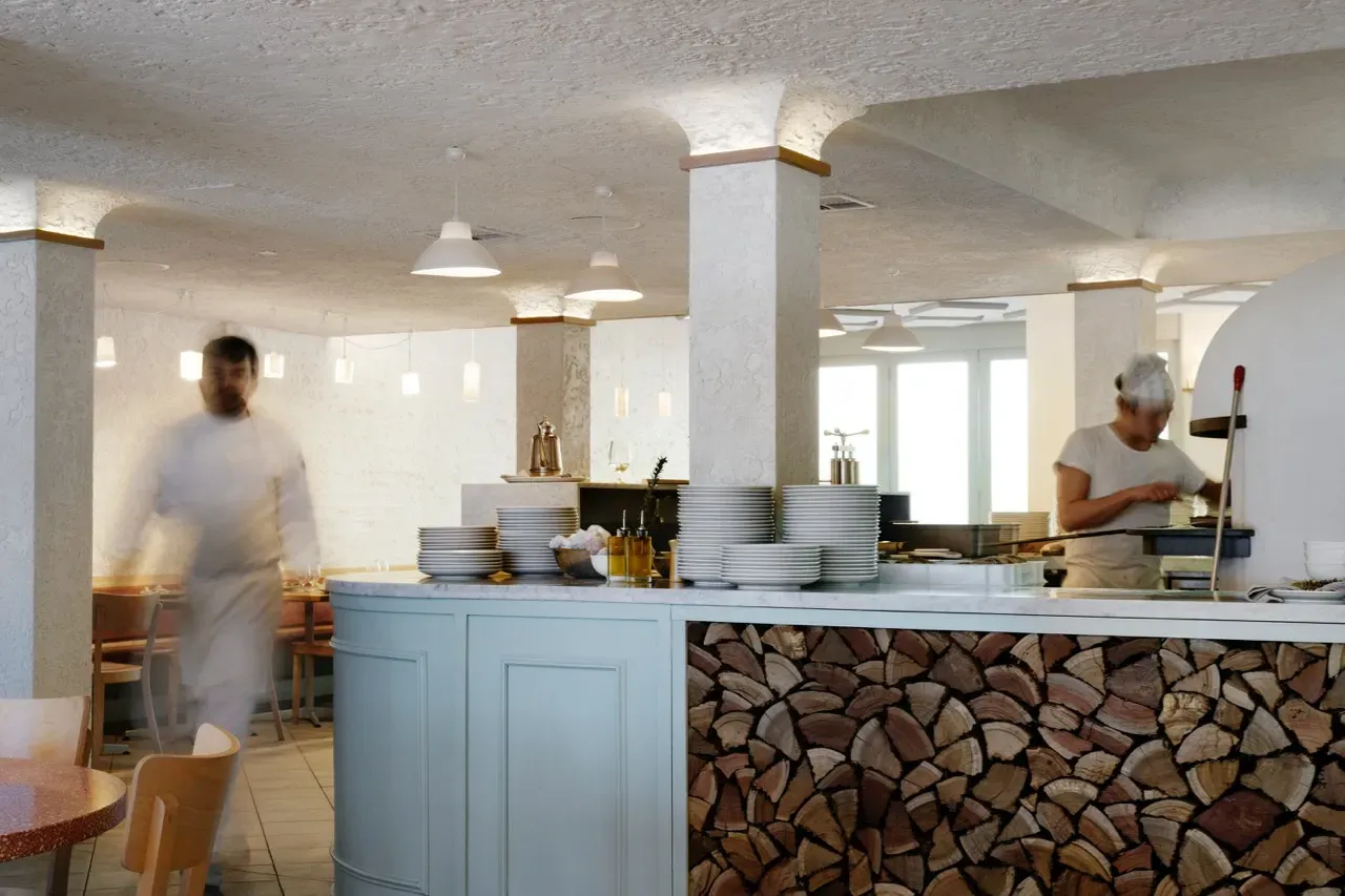 A blurred image of a restaurant with a wooden counter