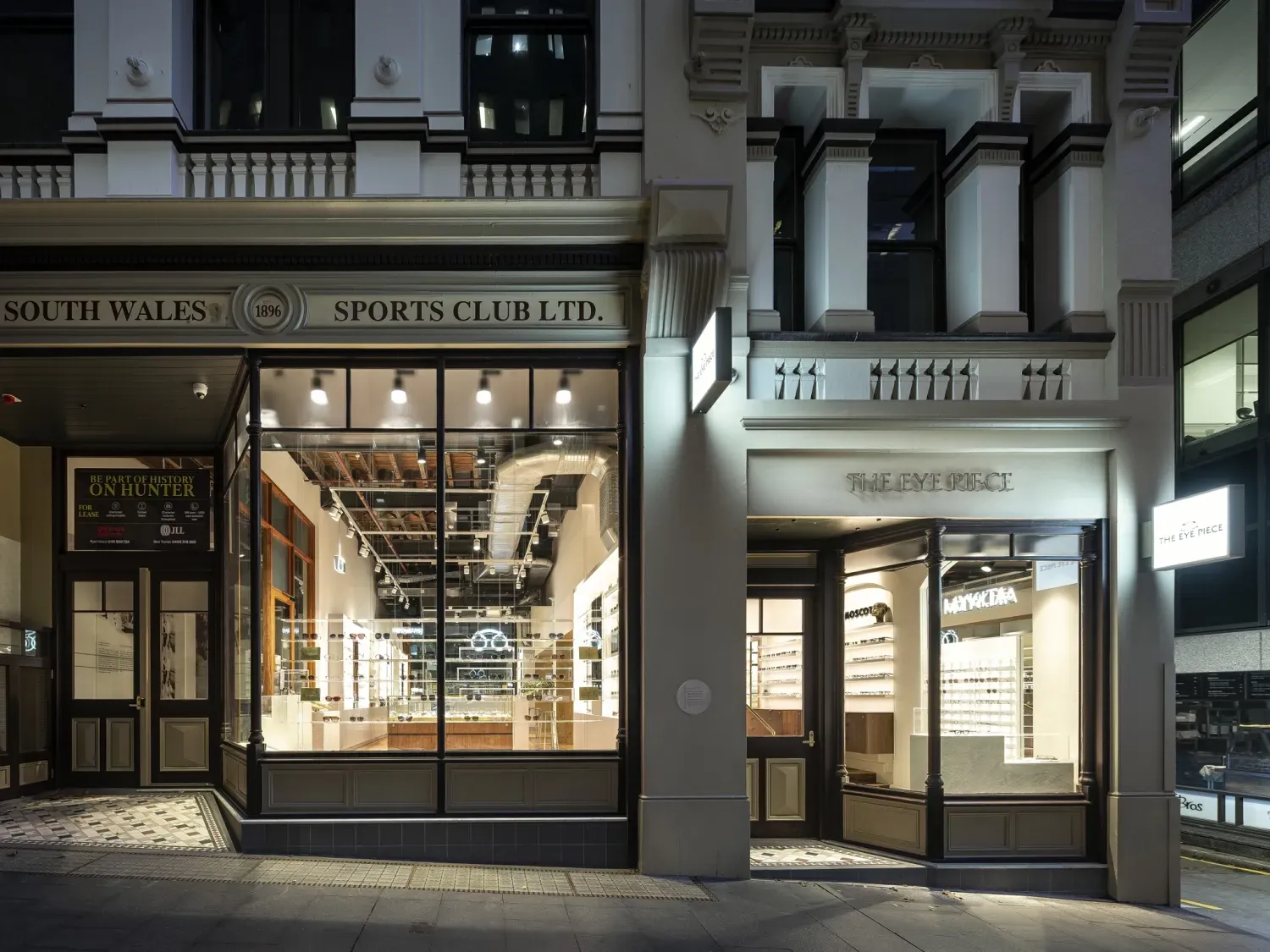 A store front with a sign that says sports club ltd