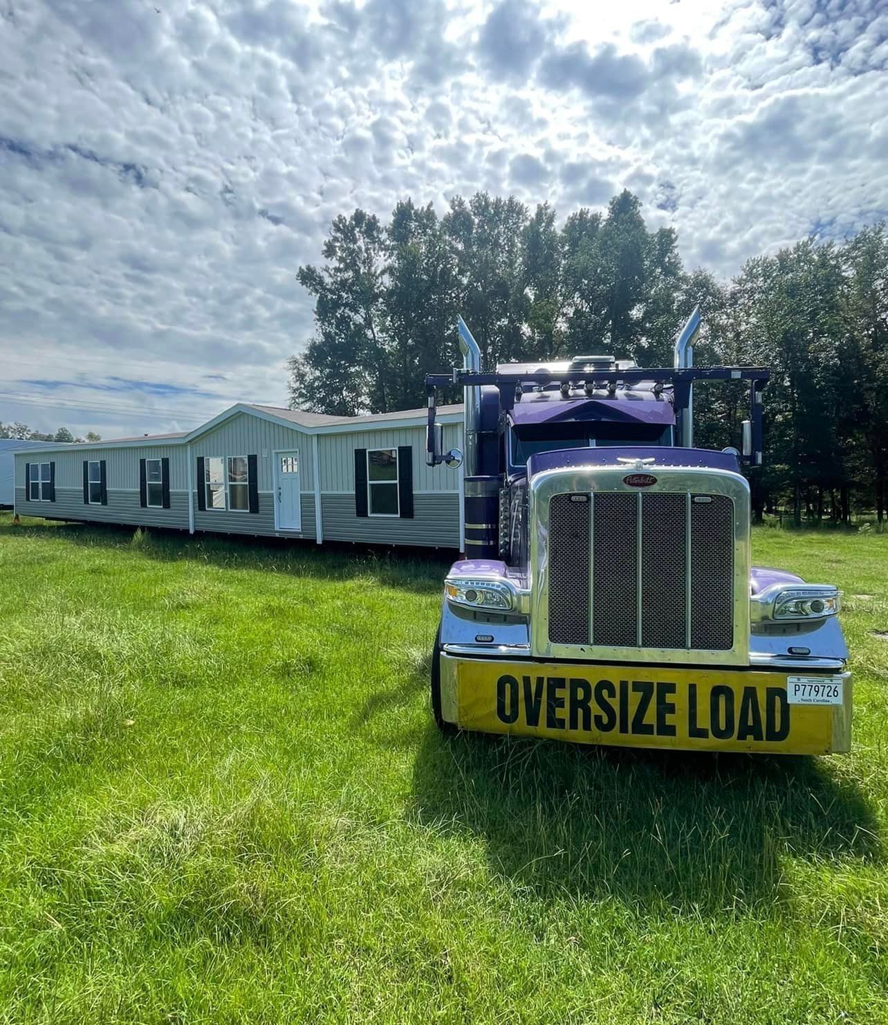Truck relocating mobile homes