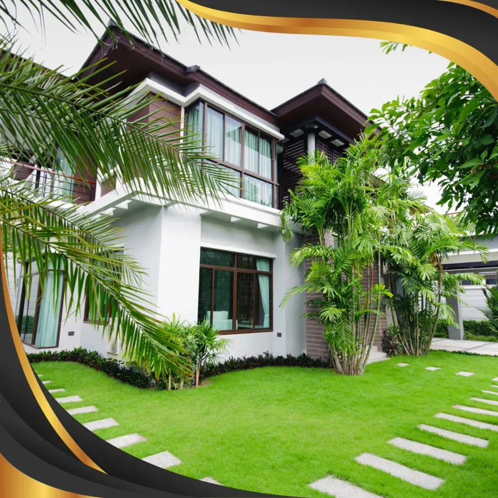 A large house with a lush green lawn in front of it