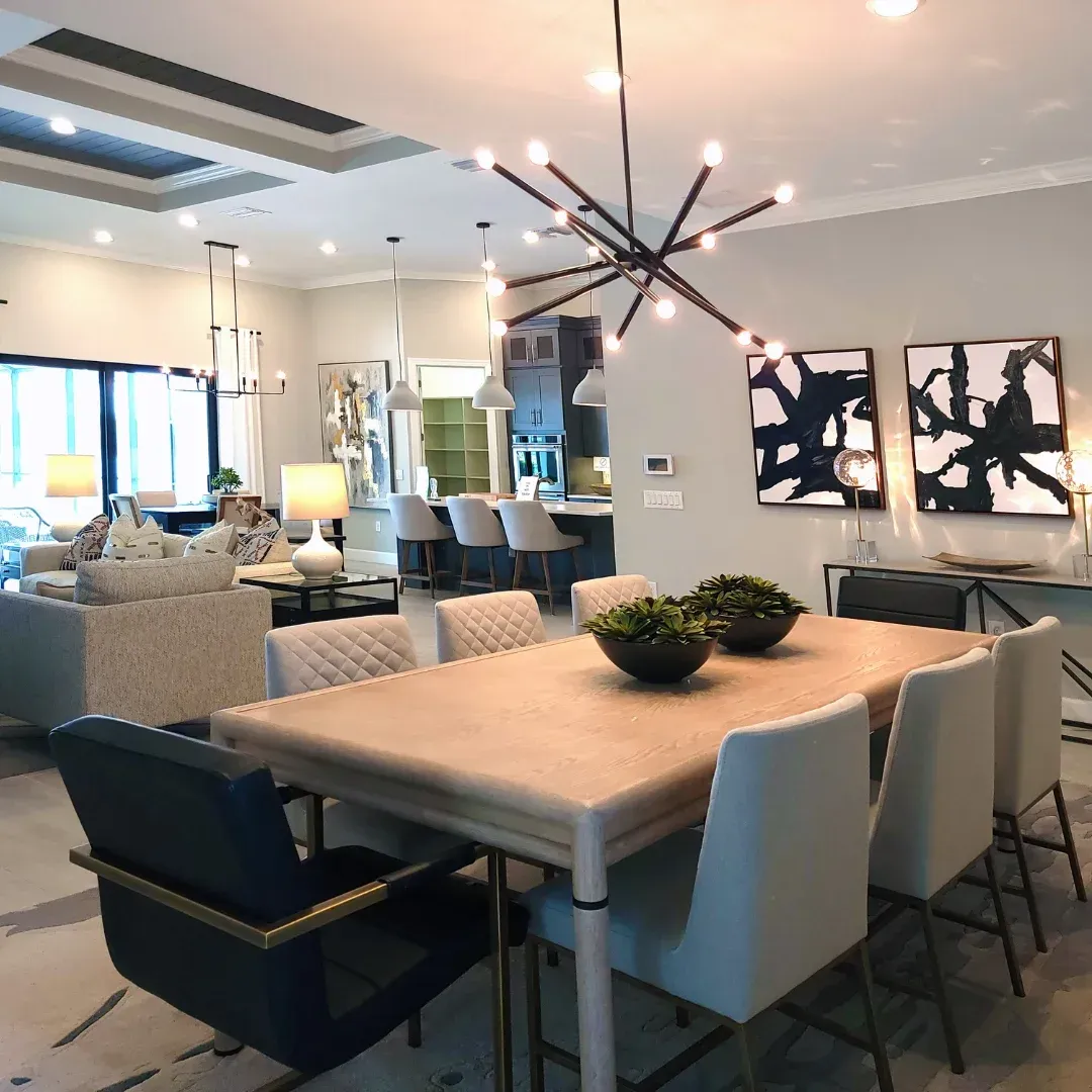 A living room with a dining table and chairs