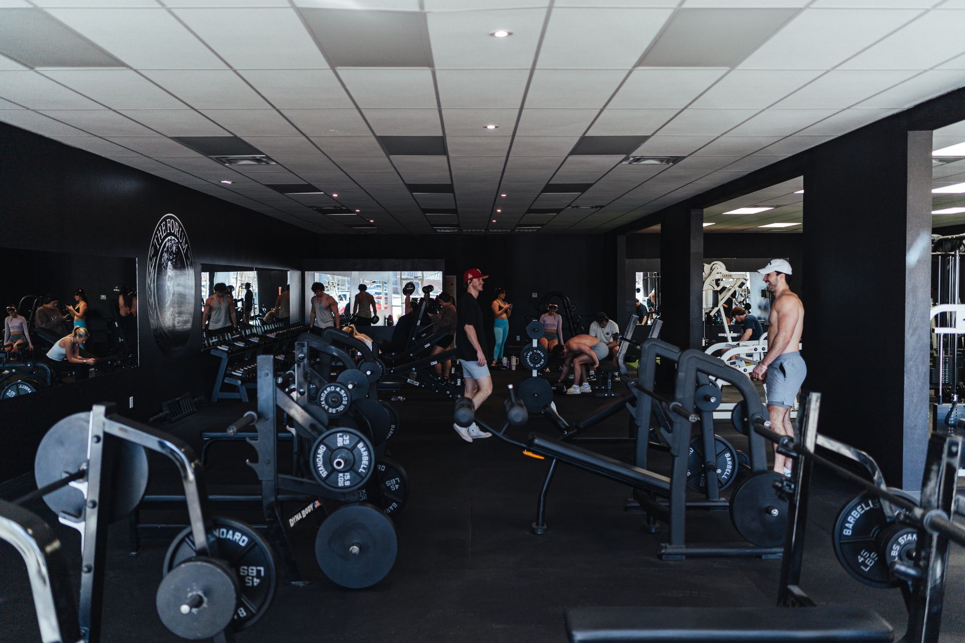 A group of people are working out in a gym.