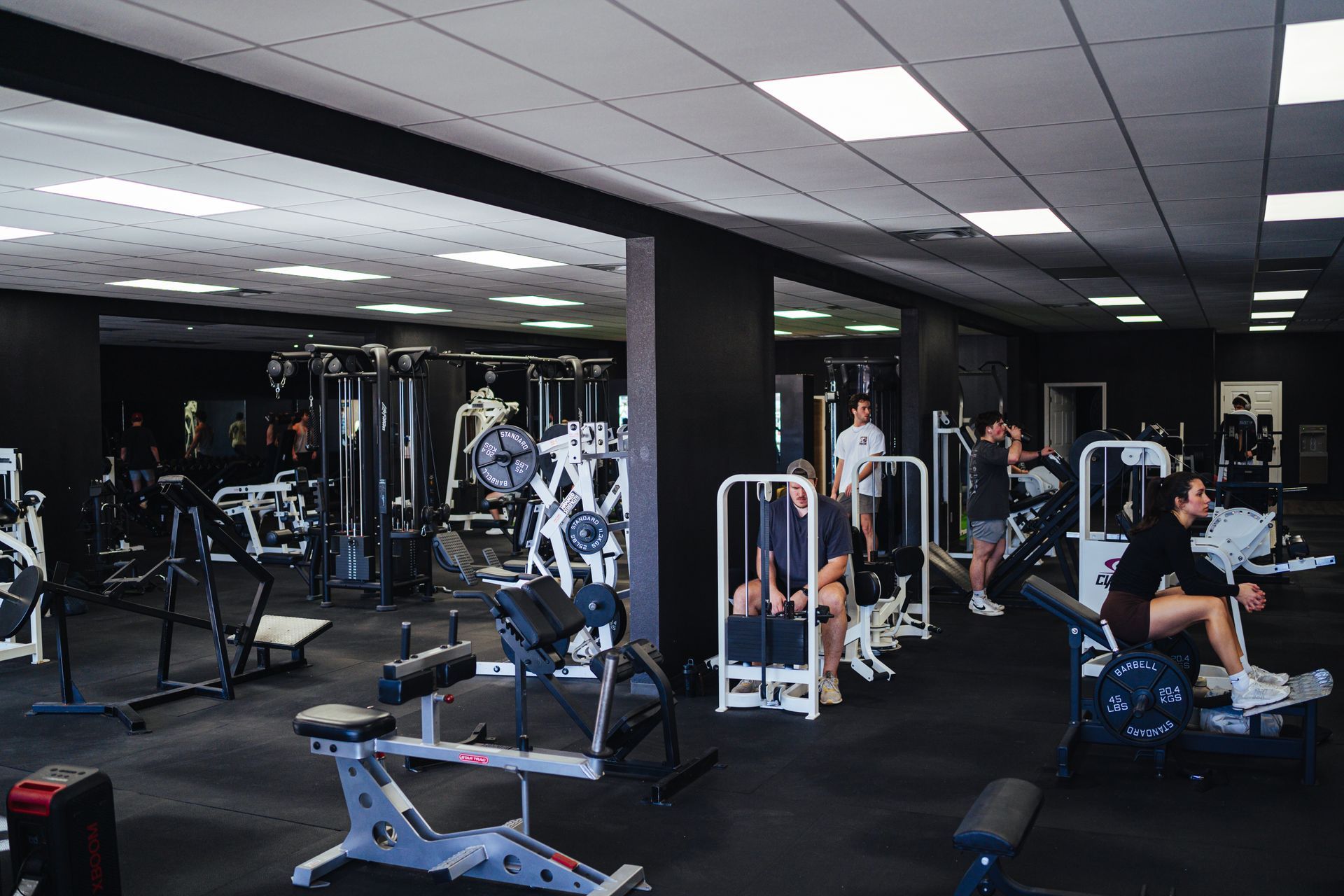 A group of people are working out in a gym.