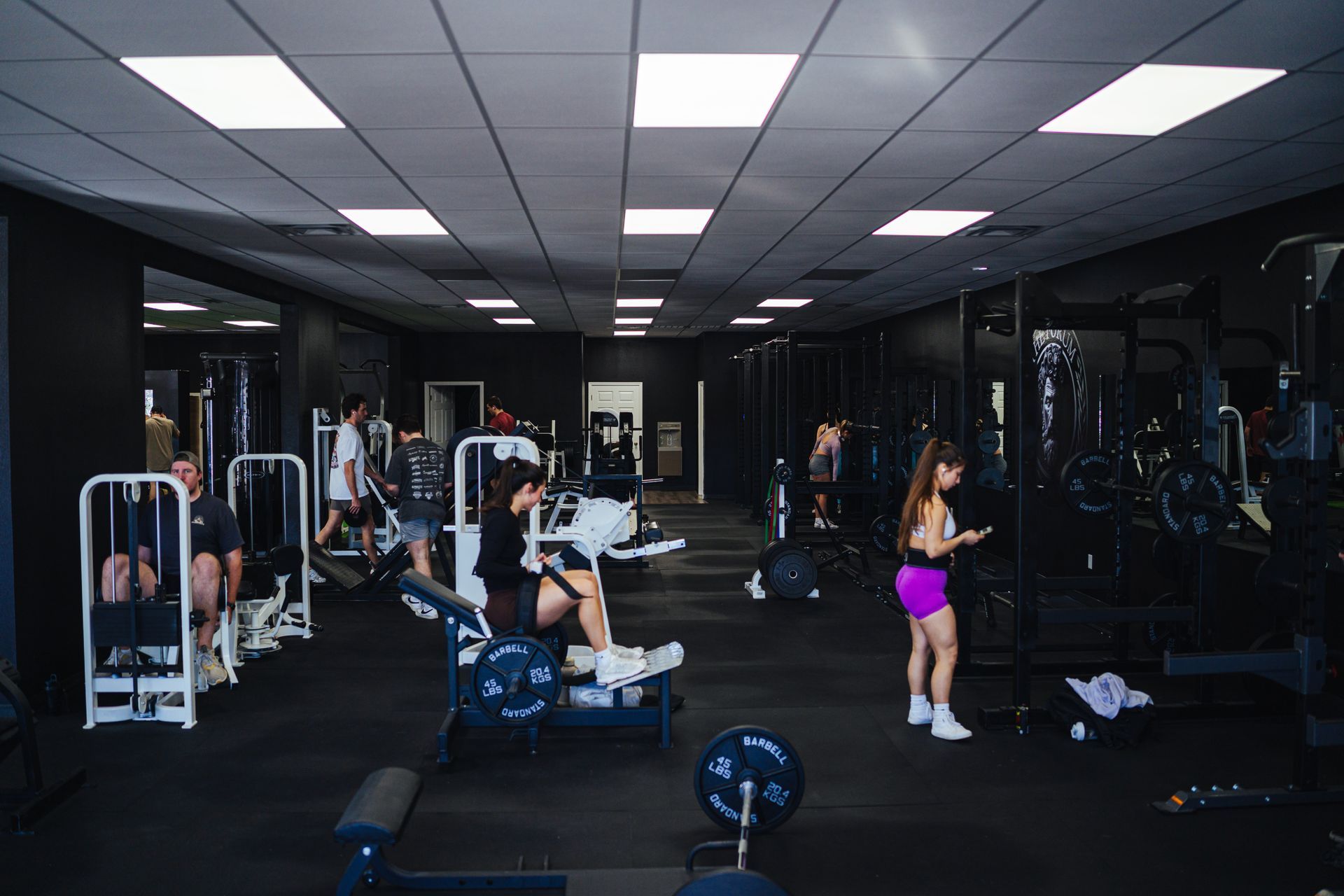 A group of people are working out in a gym.