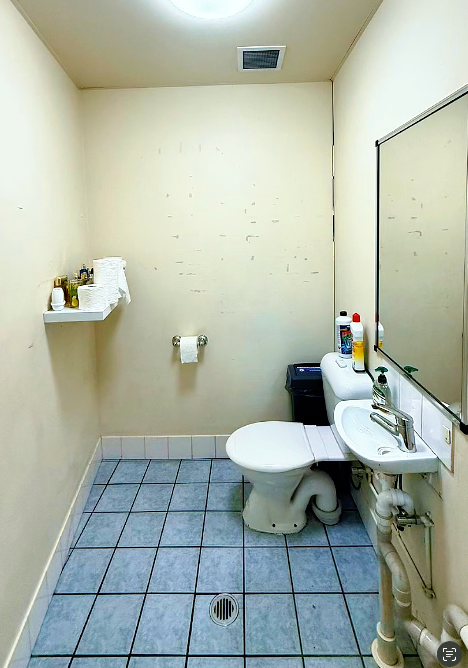 A Group Of People Are Cleaning A Kitchen — FNQ Cleaning Services in Mooroobool, QLD