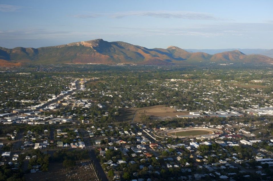 An Aerial View of a City With Mountains in the Background — FNQ Cleaning Services in Mount Sheridan, QLD