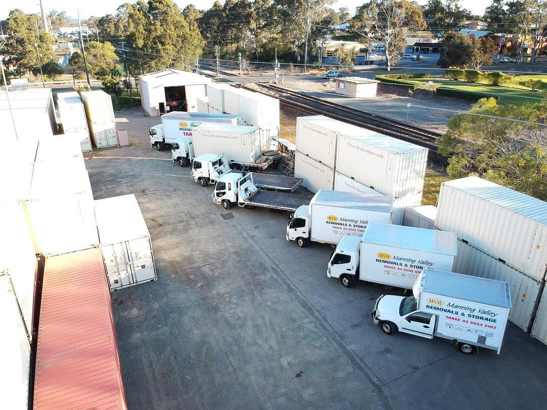 An Aerial View Of A Row Of Moving Trucks Parked In A Parking Lot — Taree Containers in Taree, NSW