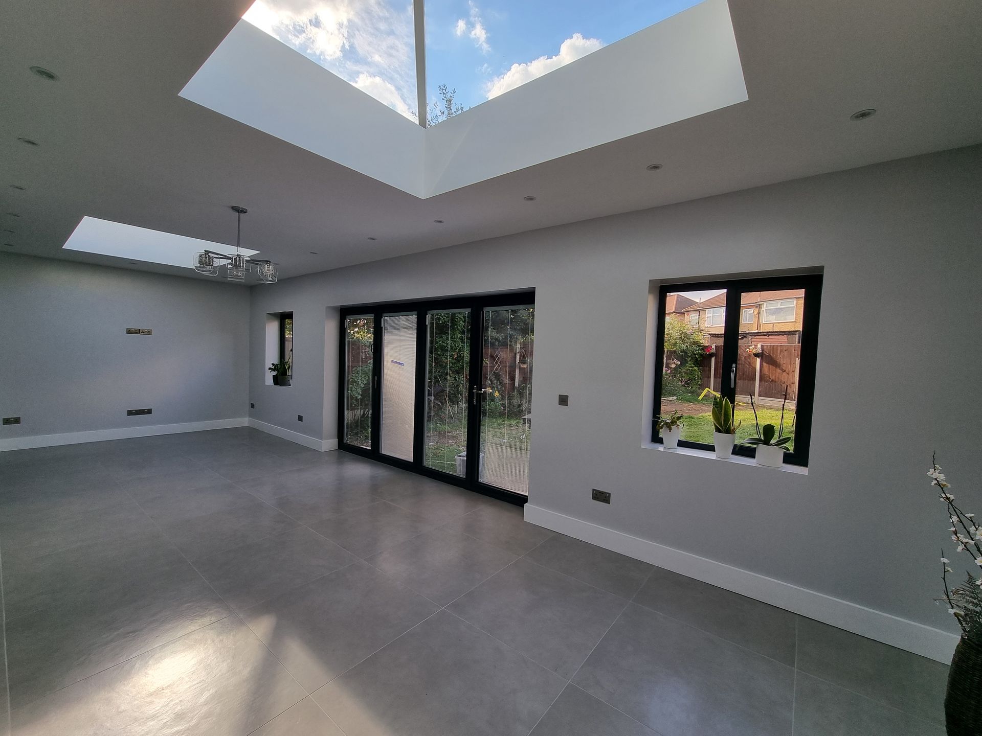 There is a skylight in the ceiling of the room.