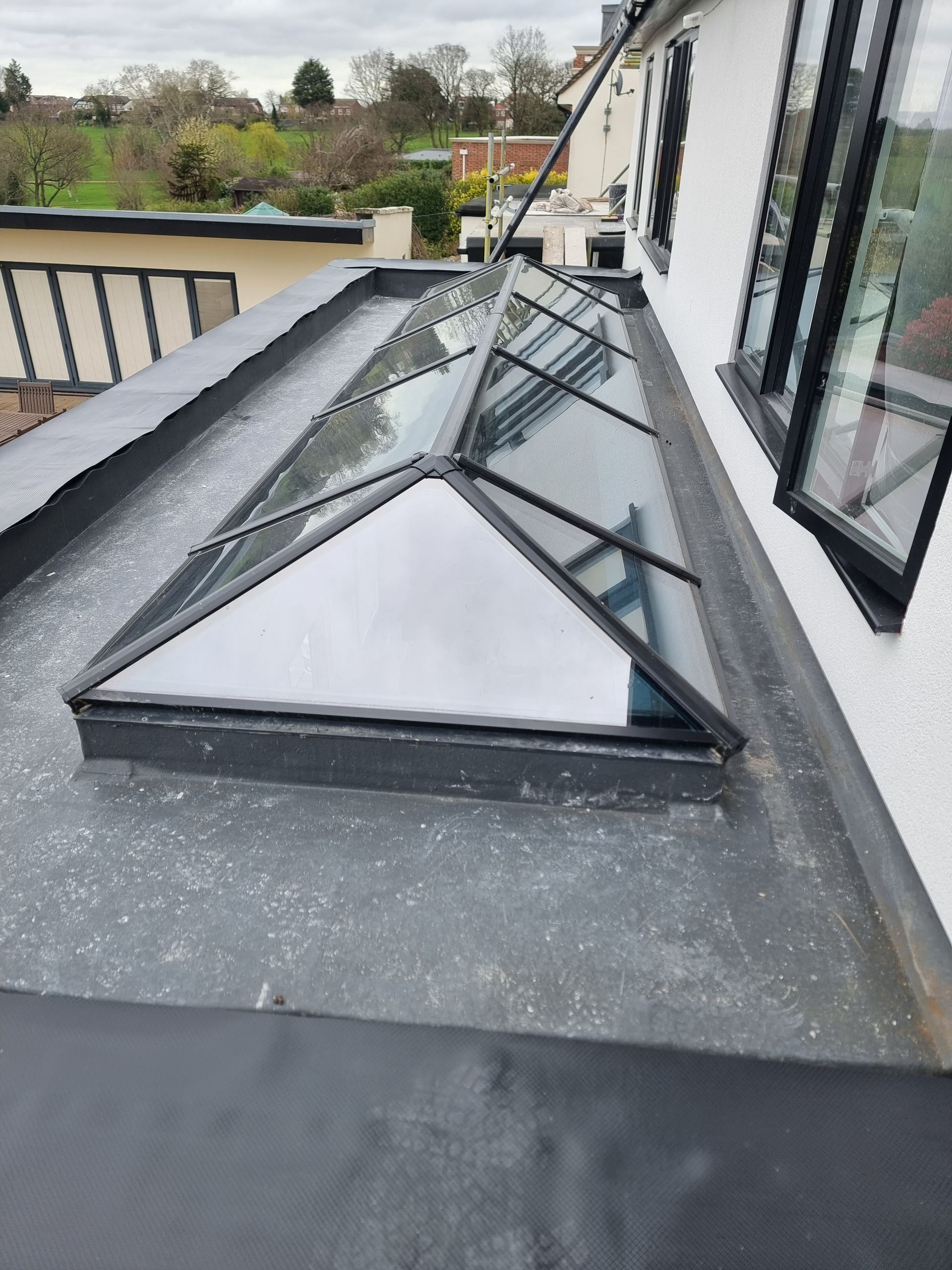 There is a skylight on the roof of a building.