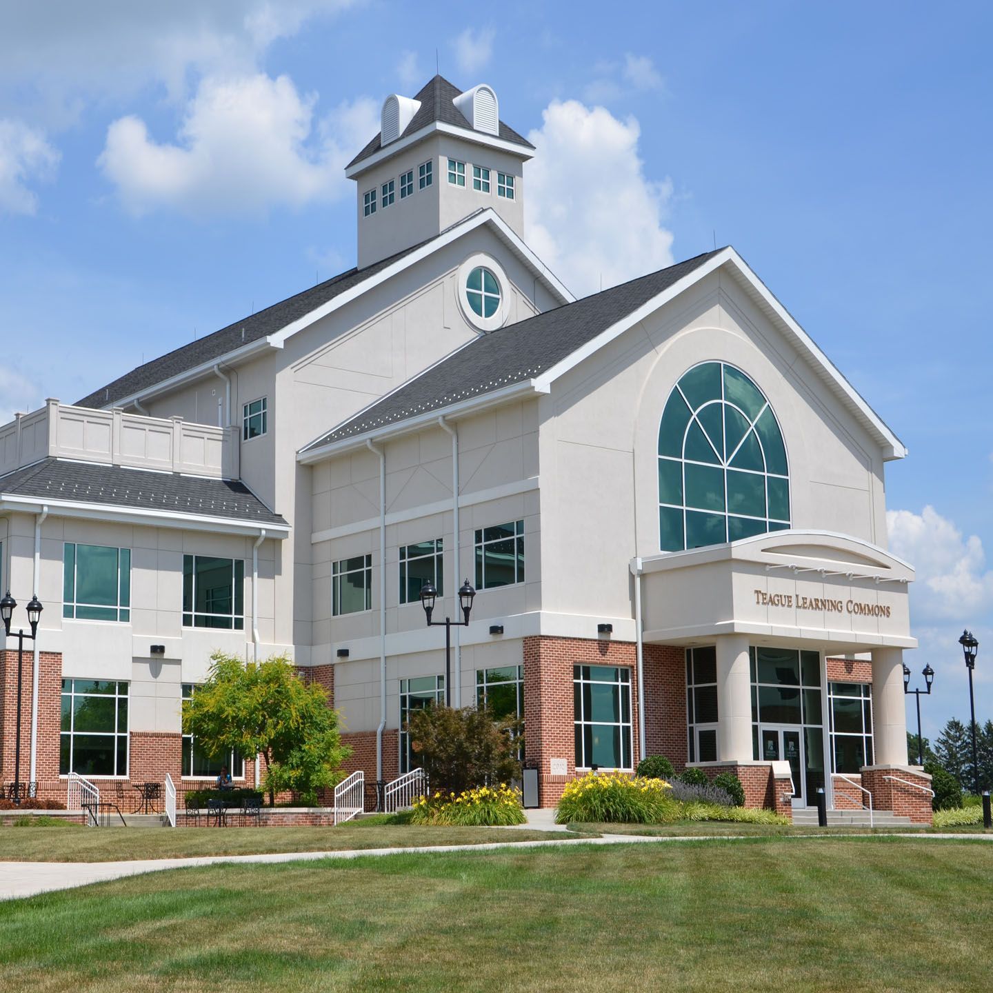 A large white building with a clock tower on top of it
