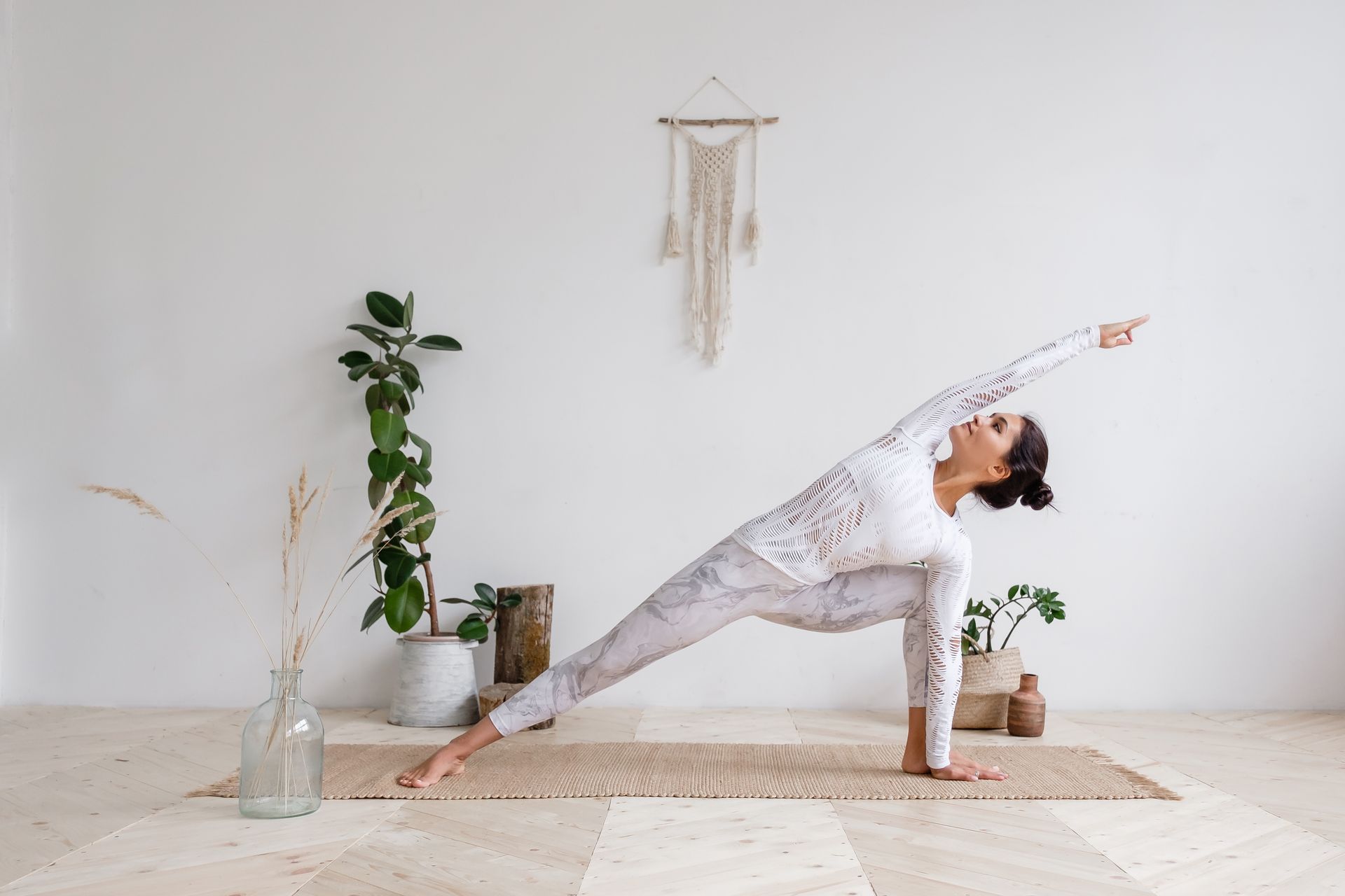 A woman is doing yoga for fertility and conception.
