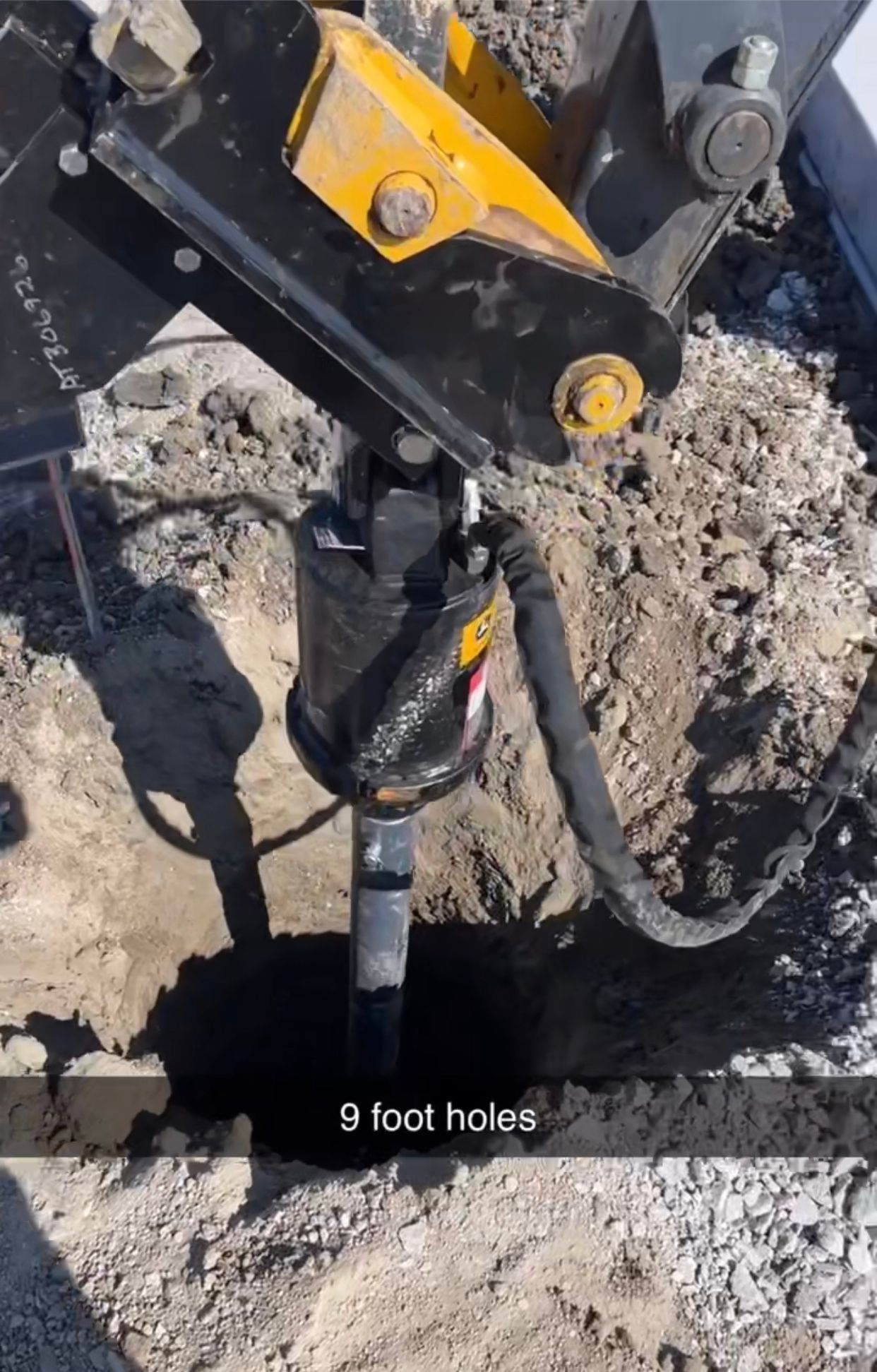 Drilling equipment over a muddy excavation with “9 foot holes” text overlay