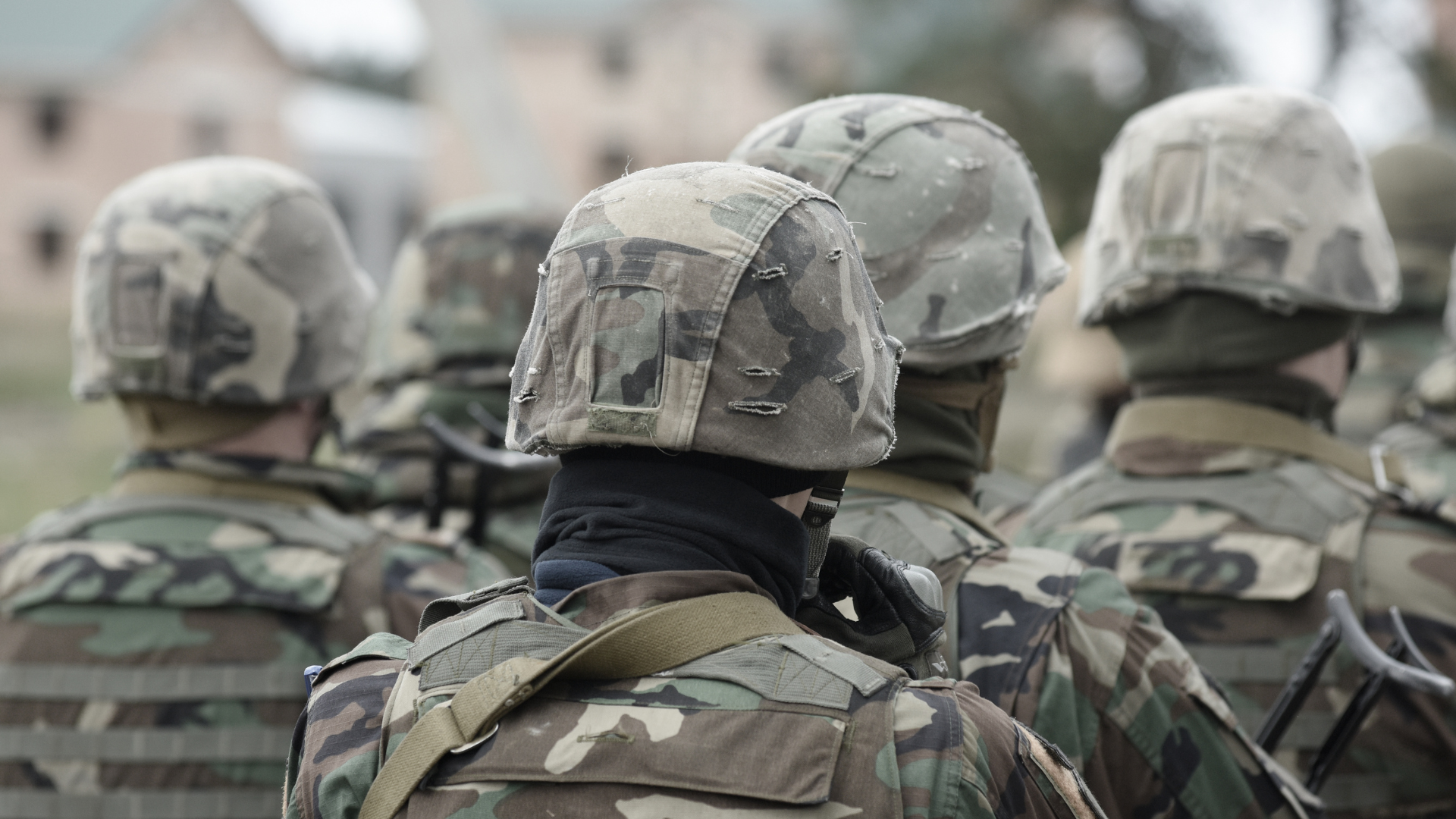 A group of soldiers are standing in a line.