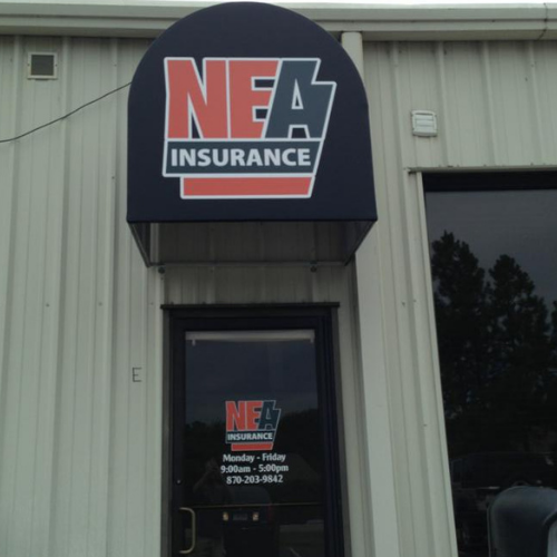 NEA Insurance office exterior with a dark blue sign, white and orange lettering, and business hours on the glass door.