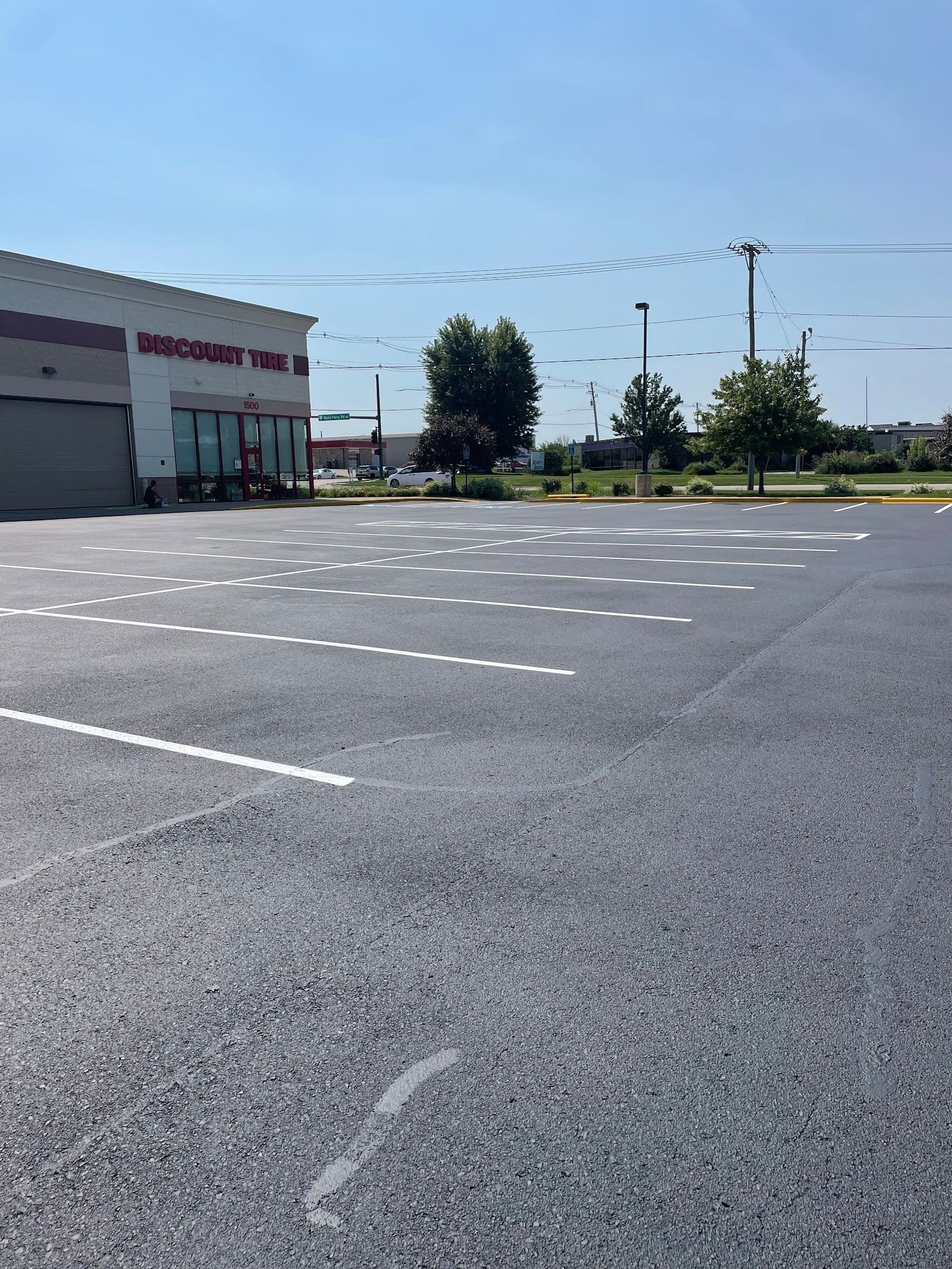 Empty parking lot outside a retail store on a sunny day