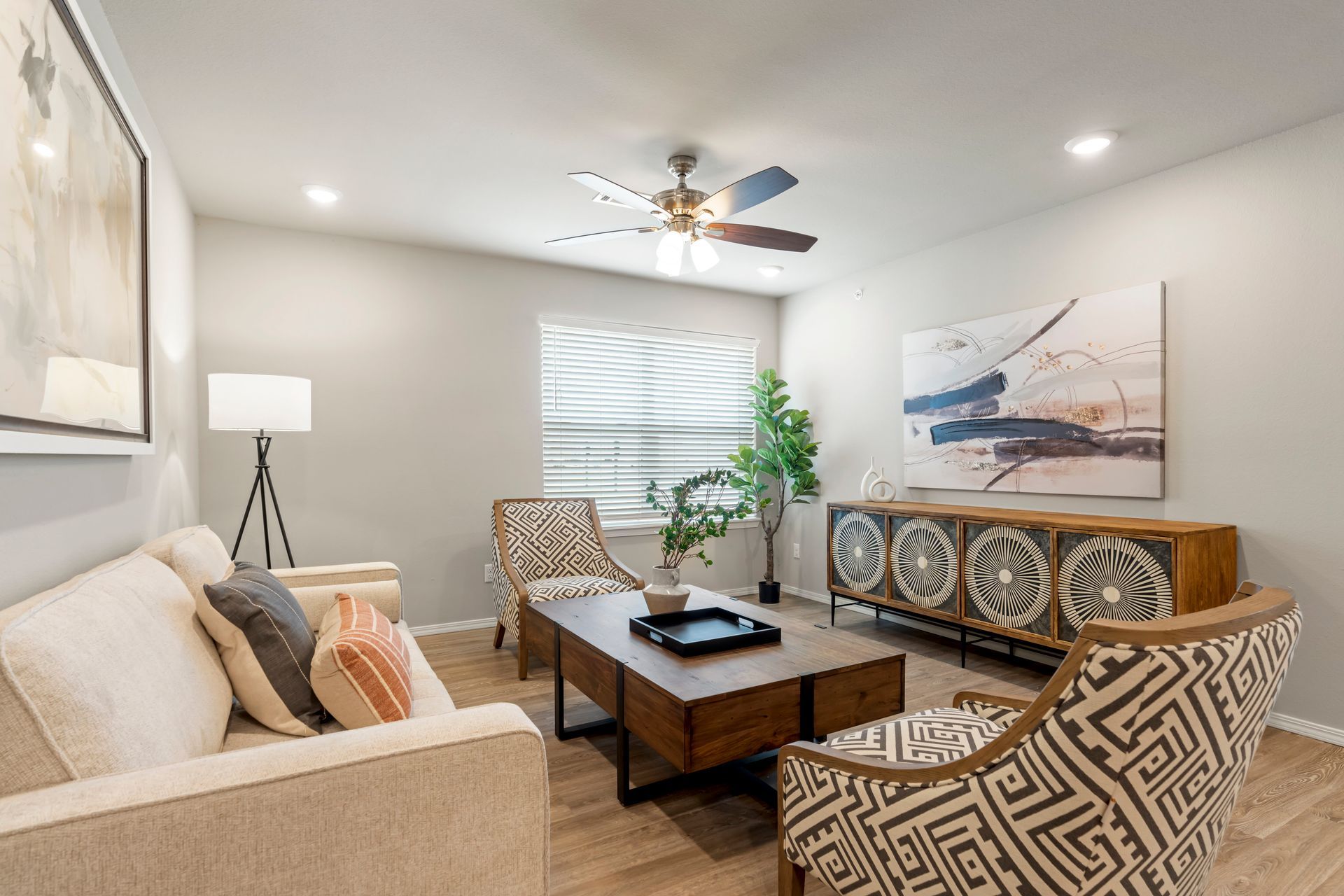 The Reserve at Springdale-furnished living room 03 with celling fan and sofa 05
