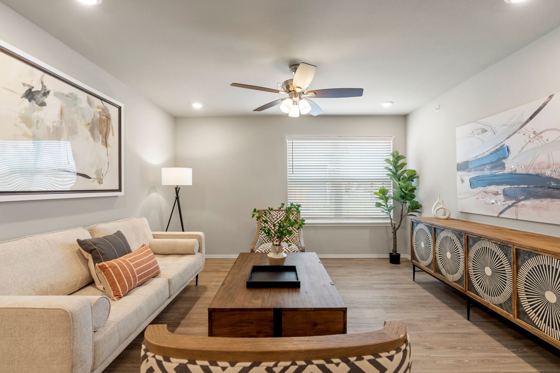 The Reserve at Springdale-furnished living room 03 with celling fan and sofa 04