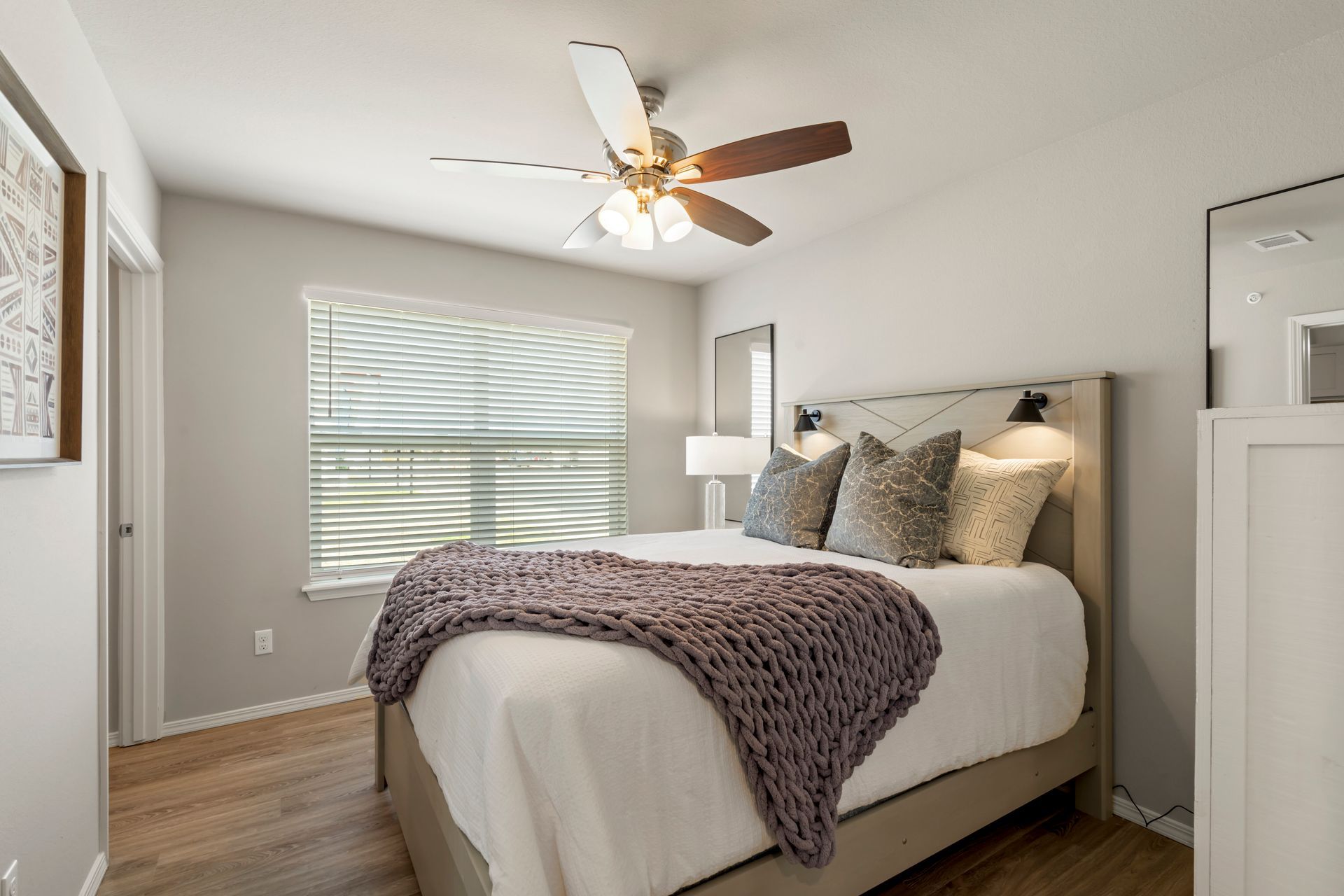 The Reserve at Springdale- Furnished bedroom with bed and celing fan and window