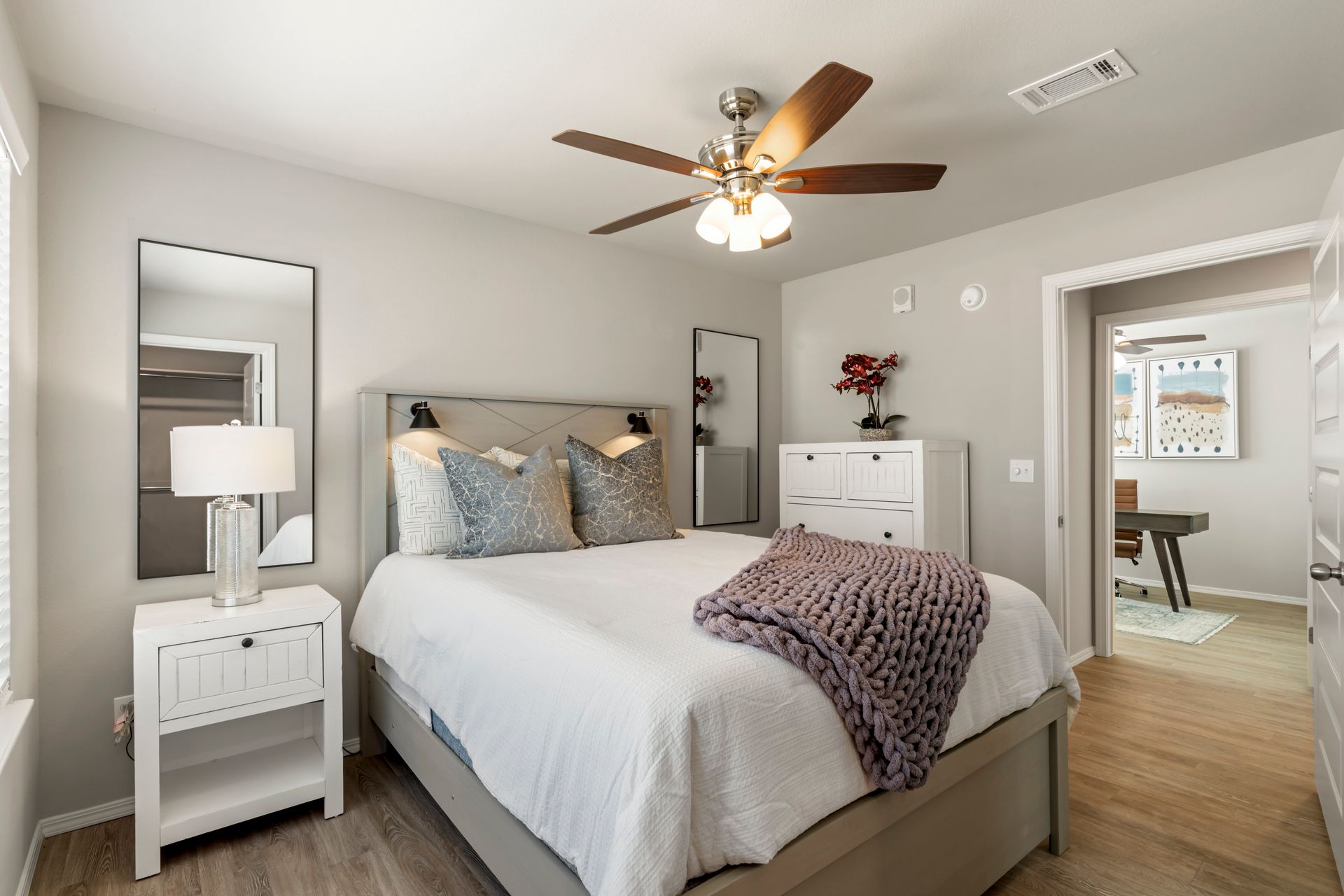 The Reserve at Springdale- Furnished bedroom with bed and celling fan and window and night stand