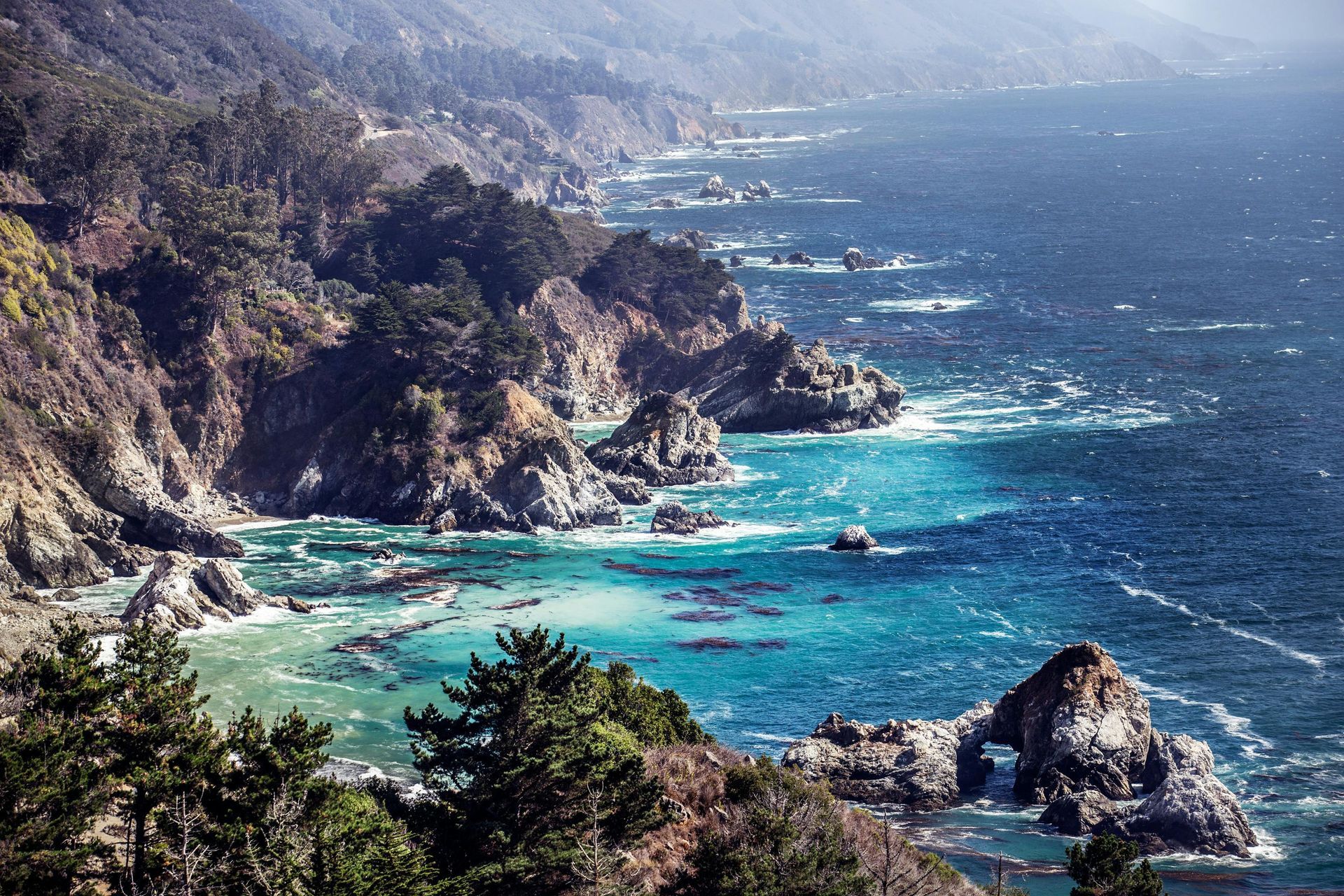 A view of a cliff overlooking a body of water