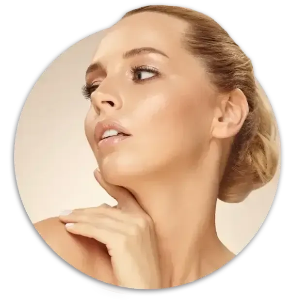 Close-up of a woman with a smooth complexion, looking to the side against a light background