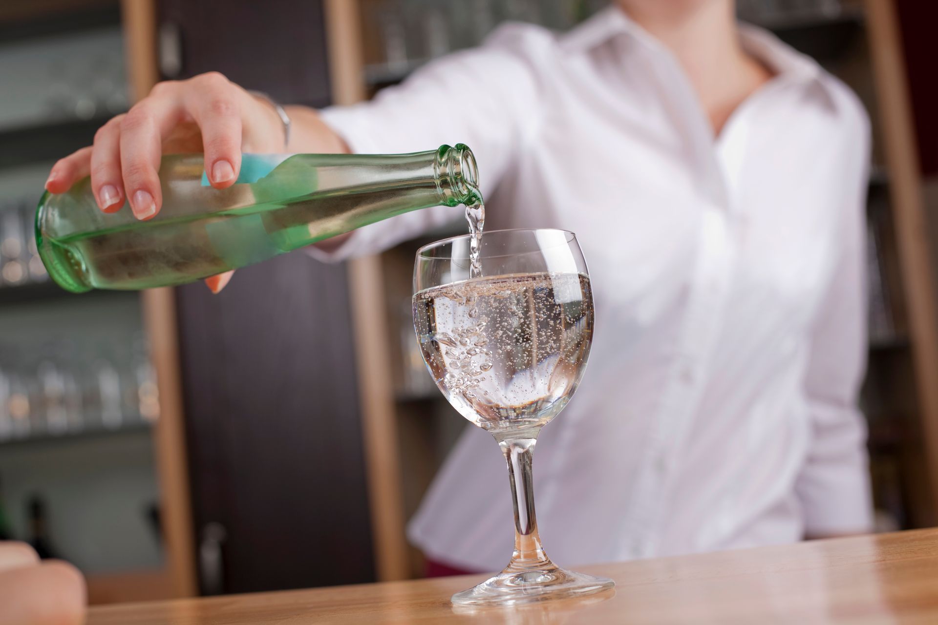 woman pouring mineral water