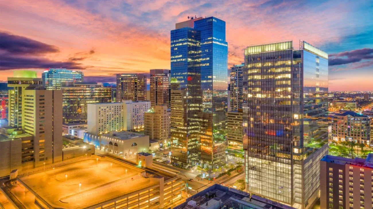 Vibrant cityscape of Phoenix, AZ highlighting why it's ideal to move now