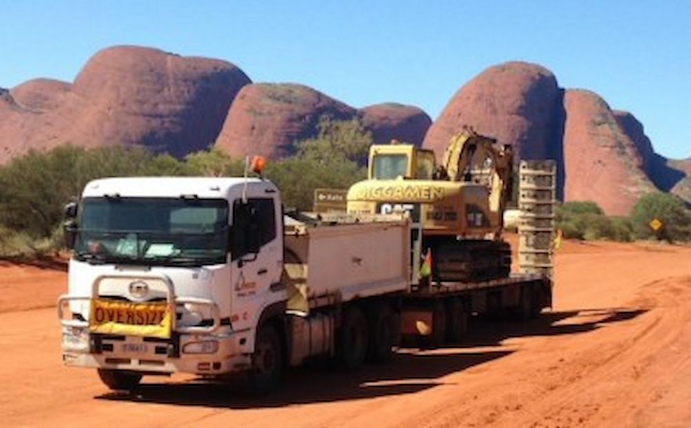 A White Truck Driving  Down the Road — Diggamen Civil Contracting in Tivendale, NT