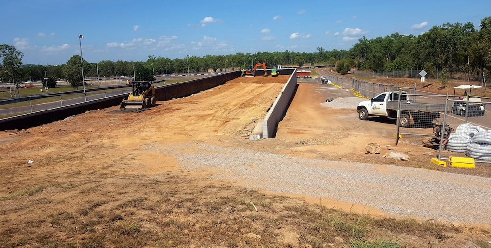 A White Truck is Parked on the Side of a Dirt Road — Diggamen Civil Contracting in Tivendale, NT